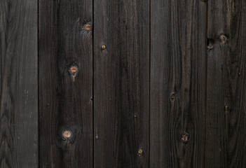 Fototapeta premium Wood texture. Old black boards with knots