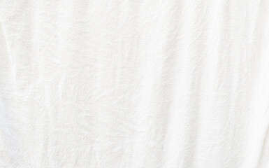 white textured fabric has wrinkles on surface