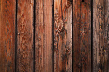 Wood texture. Old grey and orange boards with knots. Wood wallpaper. Wood background