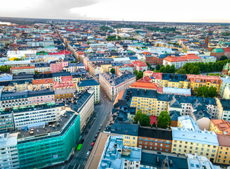 Naklejka premium Aerial sunset view of beautiful city Helsinki . Colorful sky and colorful buildings. Helsinki, Finland. 