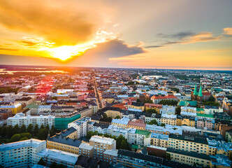 Aerial sunset view of beautiful city Helsinki . Colorful sky and colorful buildings. Helsinki, Finland.	