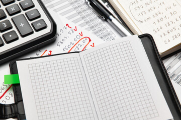 Top view of office employee's desk - work with financial reports, analysis and accounting, tables and graphs, various office items for bookkeeping