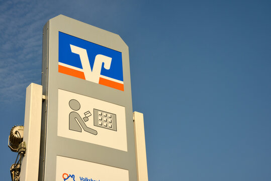 Nienhagen, Lower Saxony / Germany - September 29, 2017: Sign with the logo of the german credit union Volksbank - Raiffeisenbank in Nienhagen, Germany