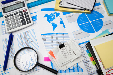 Obraz premium business office desk closeup - financial reports, analysis and accounting, set of documents, tables and graphs, various items for bookkeeping, calculator
