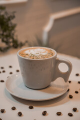 coffee latte art in a clean coffee shop with  White cup