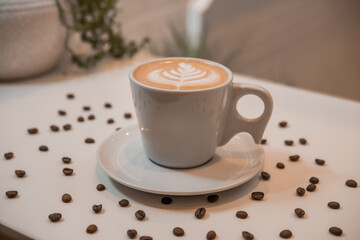 coffee latte art in a clean coffee shop with  White cup