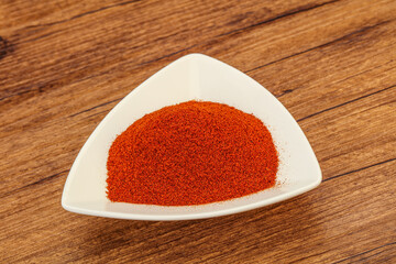 Dry paprika powder in the bowl