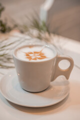 coffee latte art in a clean coffee shop with  White cup