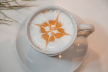 coffee latte art in a clean coffee shop with  White cup