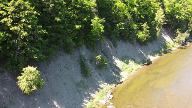panning from bottom to top of cliffs
