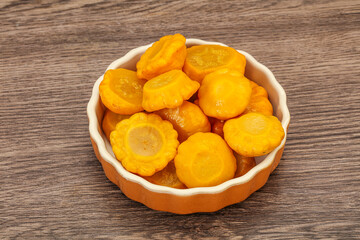 Marinated yellow patisson in the bowl