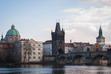 Panorama of the city of Prague, Czech Republic on a sunny day. View of Charles Bridge and the bank of the Vltava River.