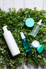 Organic cosmetics on a green spring grass background