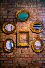 Empty vintage frames on the wall. Interior design. Copy space