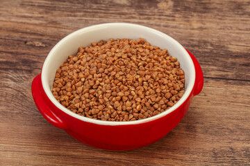 Raw buсkwheat cereal in the bowl