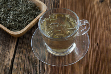 White fresh tea in the wooden plate for healthy life.