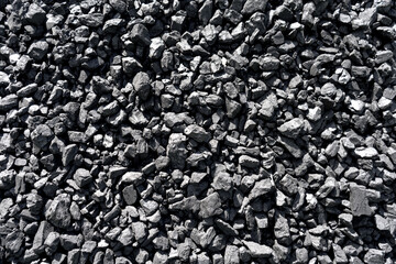 Natural coal deposits. Texture and background. Fine fraction. Top view of fuel for industry.