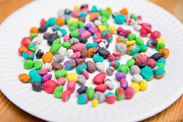 Plasticine balls in paper plate. Fine motor training. Early education of children. Montessori methodology.