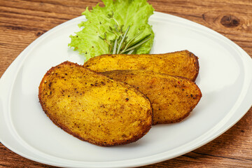Baked potato with herbs and spices