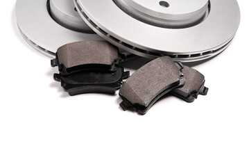 brand new brake discs and brake pad set for car. isolated on white with copy space.