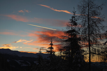 The sunset in top of the mountains in the winter