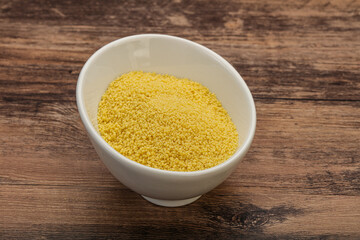 Raw cous cous heap in the bowl