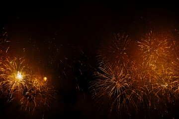 Fototapeta na wymiar New Year celebration fireworks. Fourth of July Fireworks. Fireworks light up the sky with dazzling display. glowing fireworks show