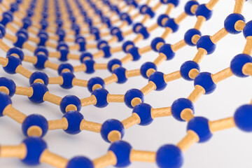 3D rendering of nanotube surface, blue carbon atoms, yellow bonds, light background