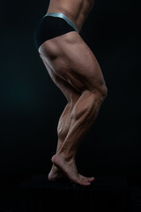 Fototapeta na wymiar Muscled male legs on isolated background