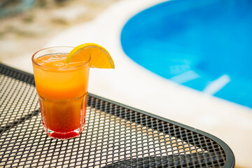 Tropical mixology on wooden bar, mixology with pool in a holiday setting. Caribbean cocktails.