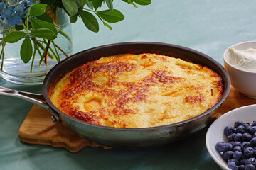 Peach Dutch pancake in a pan