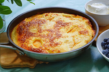 Peach Dutch pancake in a pan