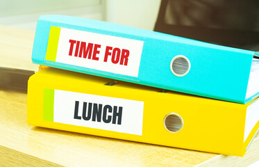 Two office folders with text time for lunch
