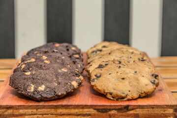 homemade chocolate and vanilla cookies on wood