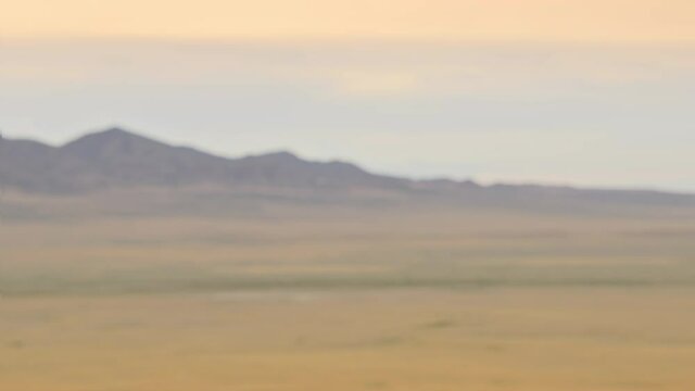 Desert 4k background plate for green screen and VFX, Medium Close Up (MCU). Seamless loop, natural blur. Match with 85mm at f/10 on an APS-C sensor (1.53 crop, 130mm equivalent), focus at 10ft.