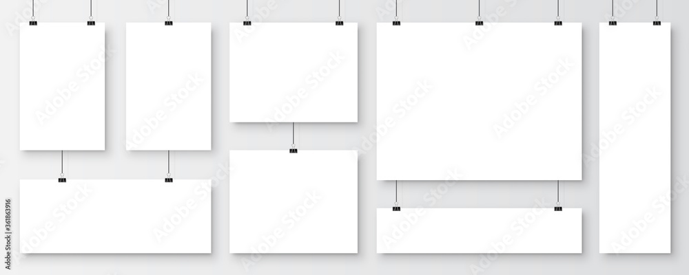 Wall mural realistic blank paper sheets hanging on binder clip. white vector poster with shadow in a4 format. d