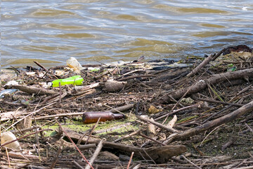 Floating old garbage in water, plastic bottles
