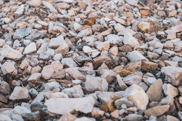 Gray gravel, crushed stone close-up, front view. Photos with low depth of field. High quality photo