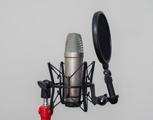 Studio condenser microphone setup on white background