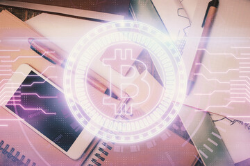 Double exposure of blockchain theme hologram over table with phone. Top view. Crypto technology...