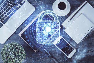 Double exposure of lock drawing over desktop. Top view. Security concept.