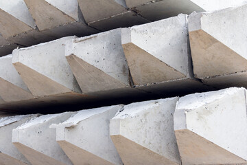 Reinforced concrete piles for the foundation of the building. Materials for construction. Concrete base of the building