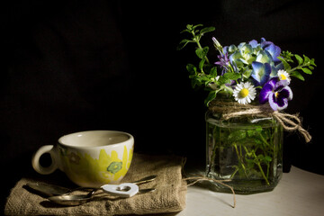 still life with flowers and a cup of coffee