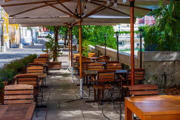 street cafe near the river in the city of Ljubljana