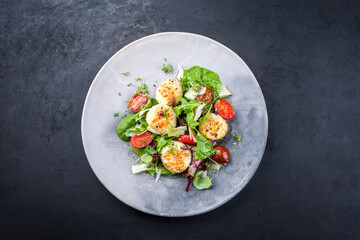 Traditional barbecue scallops with tomatoes, lettuce and Italian parmesan cheese offered as top...
