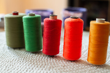 Sewing threads, home on the table colorful close up
