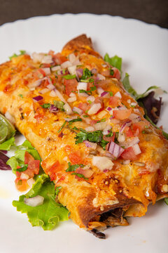 delicious mexican chicken enchilada with vegetables. Vertical image