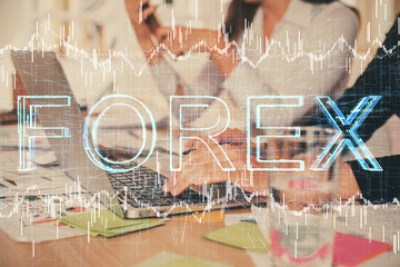 Multi exposure of woman hands typing on computer and forex chart hologram drawing. Stock market analysis concept.