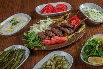 Turkish Butcher Meatball Dinner on wooden background.