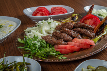 Turkish Butcher Meatball Dinner on wooden background.
